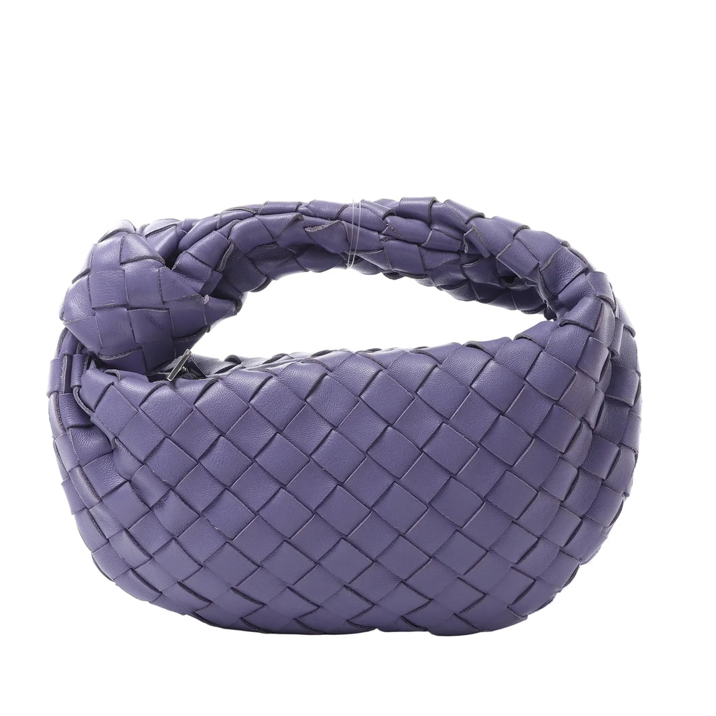 Bottega Veneta Jodie Mini handbag in purple woven Intrecciato leather with a knotted top handle and soft rounded shape.