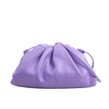 Bottega Veneta Mini The Pouch crossbody bag in purple calfskin leather with a soft gathered silhouette and matching leather strap.