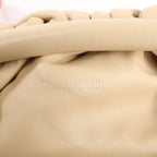 Bottega Veneta Mini The Pouch Leather Crossbody bag in Beige