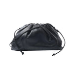 Bottega Veneta The Pouch Mini black leather crossbody bag with a softly gathered top and slim knotted shoulder strap.