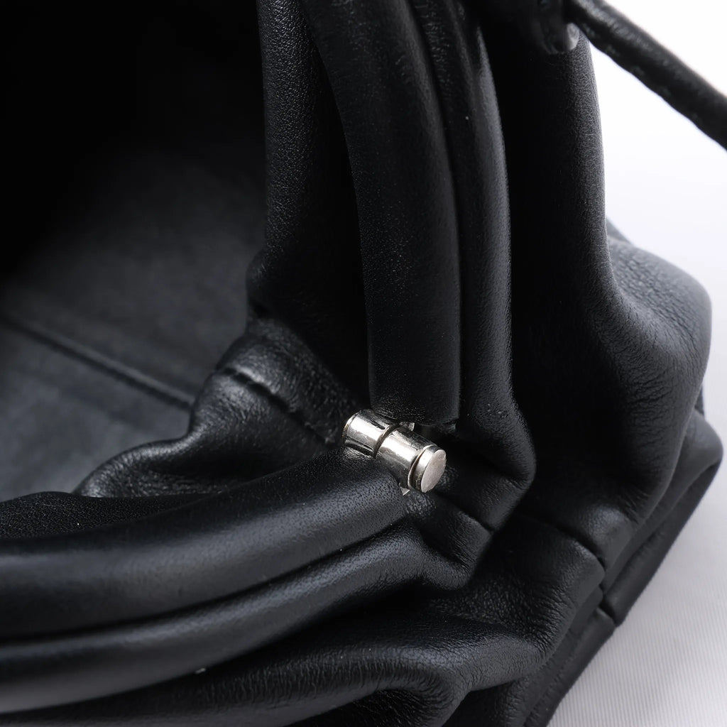 Bottega Veneta The Pouch Mini Leather Crossbody bag in Black