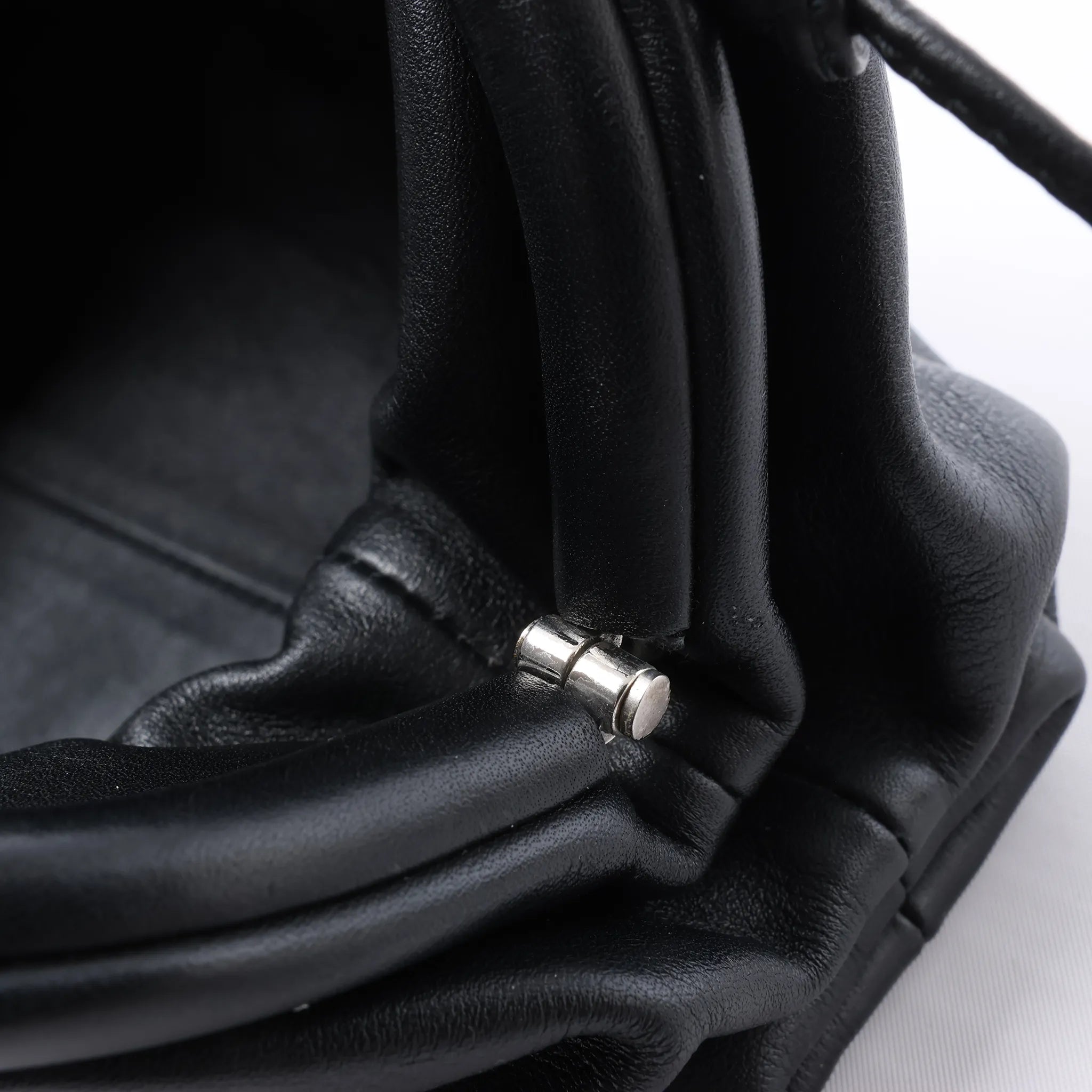Bottega Veneta The Pouch Mini Leather Crossbody bag in Black