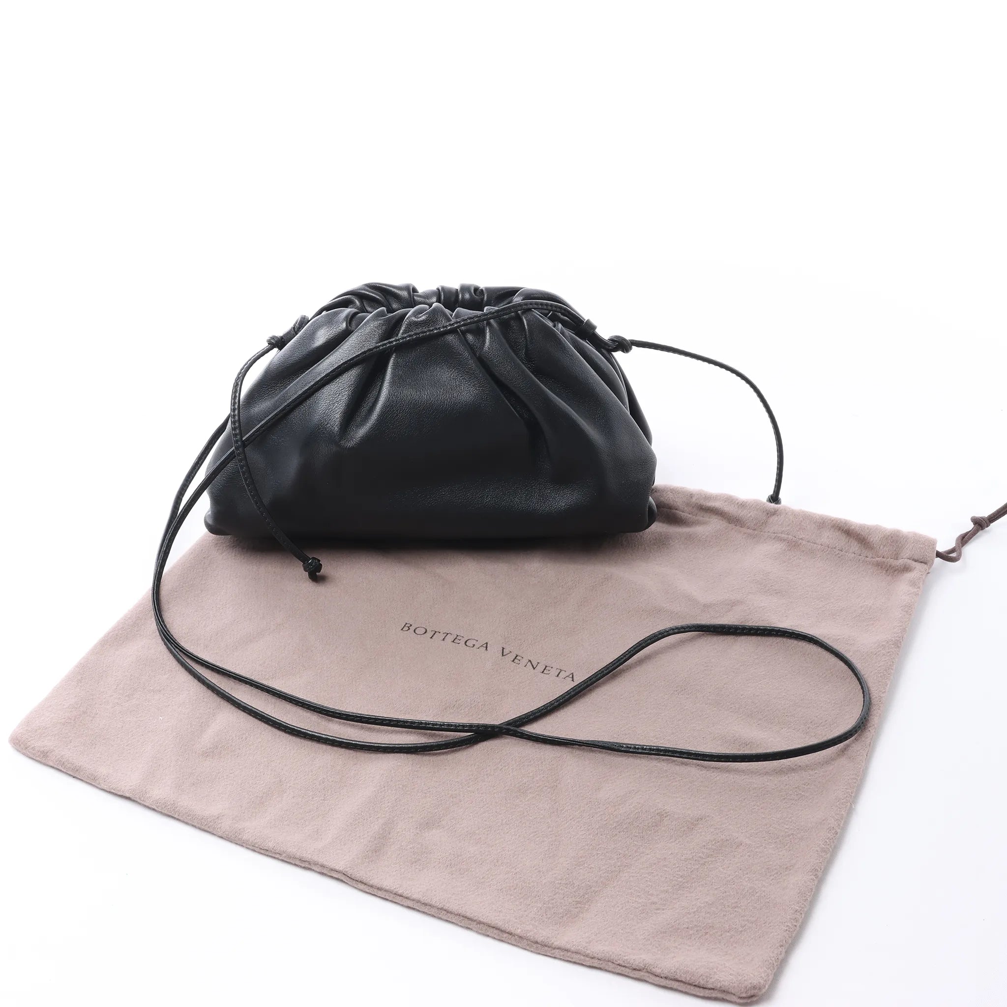 Bottega Veneta The Pouch Mini Leather Crossbody bag in Black