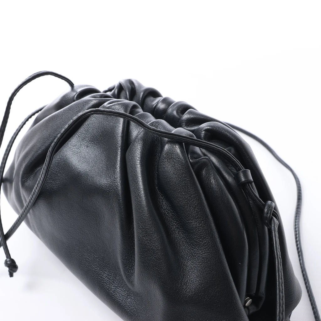 Bottega Veneta The Pouch Mini Leather Crossbody bag in Black