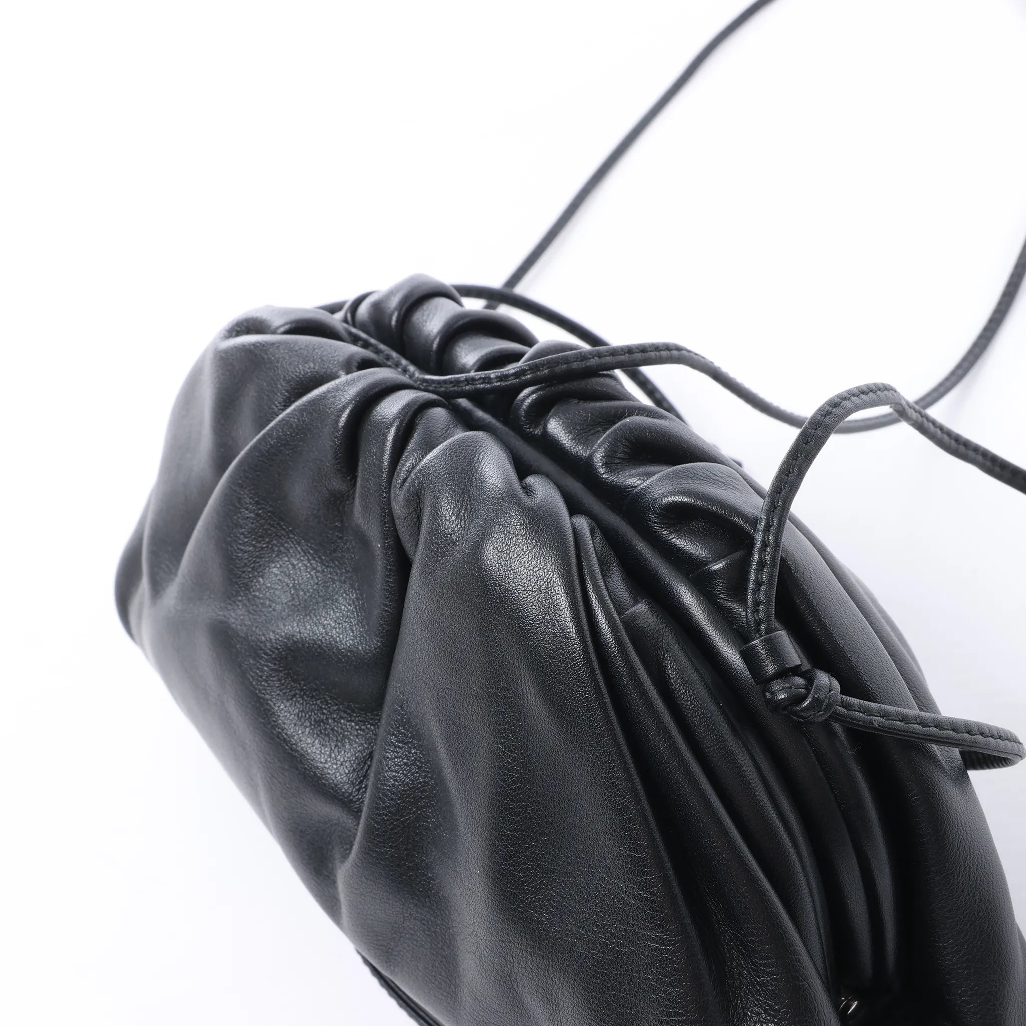 Bottega Veneta The Pouch Mini Leather Crossbody bag in Black