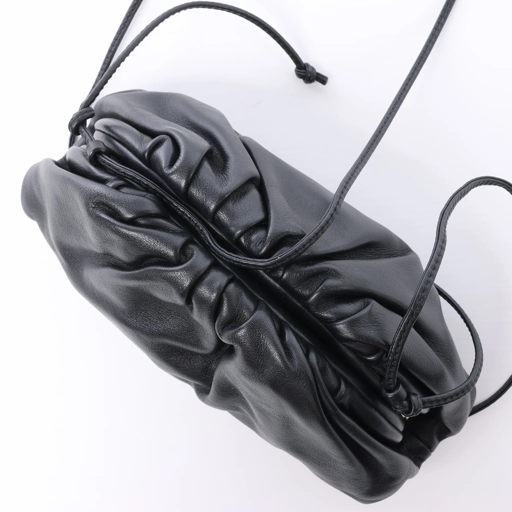 Bottega Veneta The Pouch Mini Leather Crossbody bag in Black