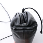 Bottega Veneta The Pouch Mini Leather Crossbody bag in Black
