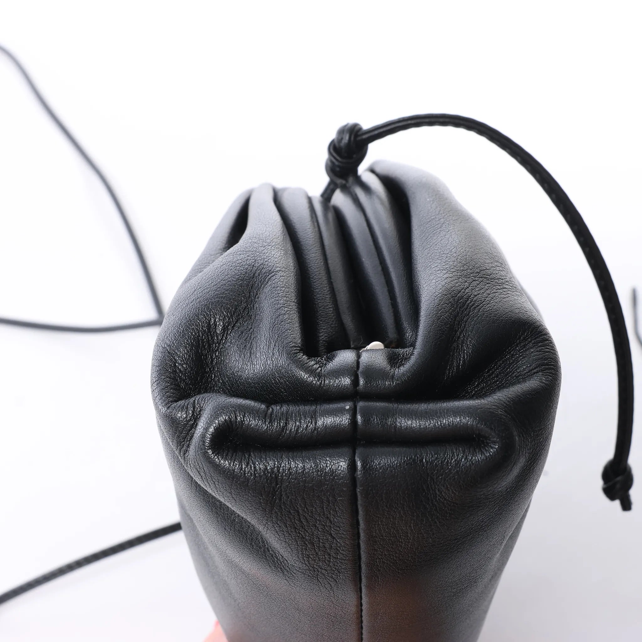 Bottega Veneta The Pouch Mini Leather Crossbody bag in Black