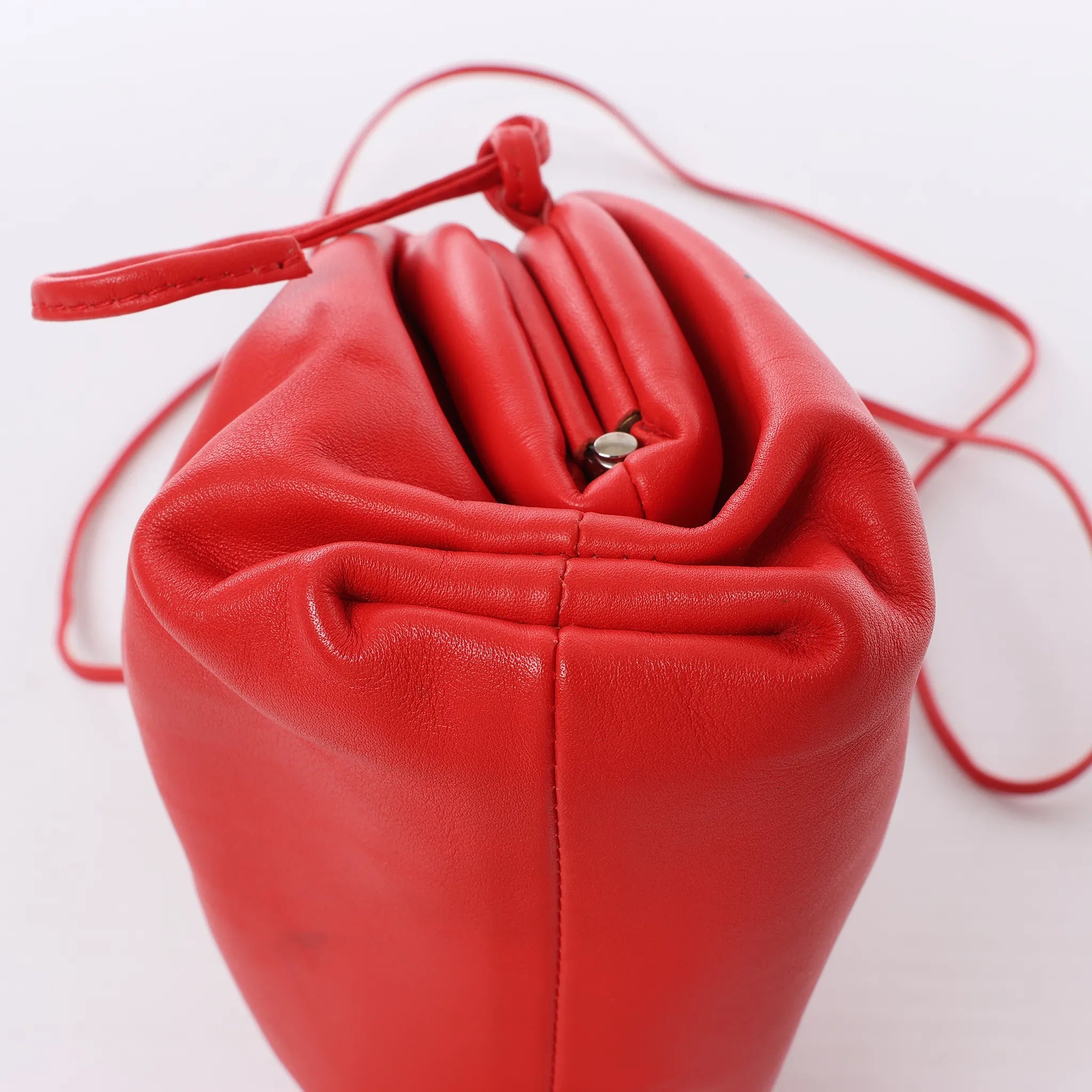 Bottega Veneta Mini The Pouch Leather Crossbody bag in Red