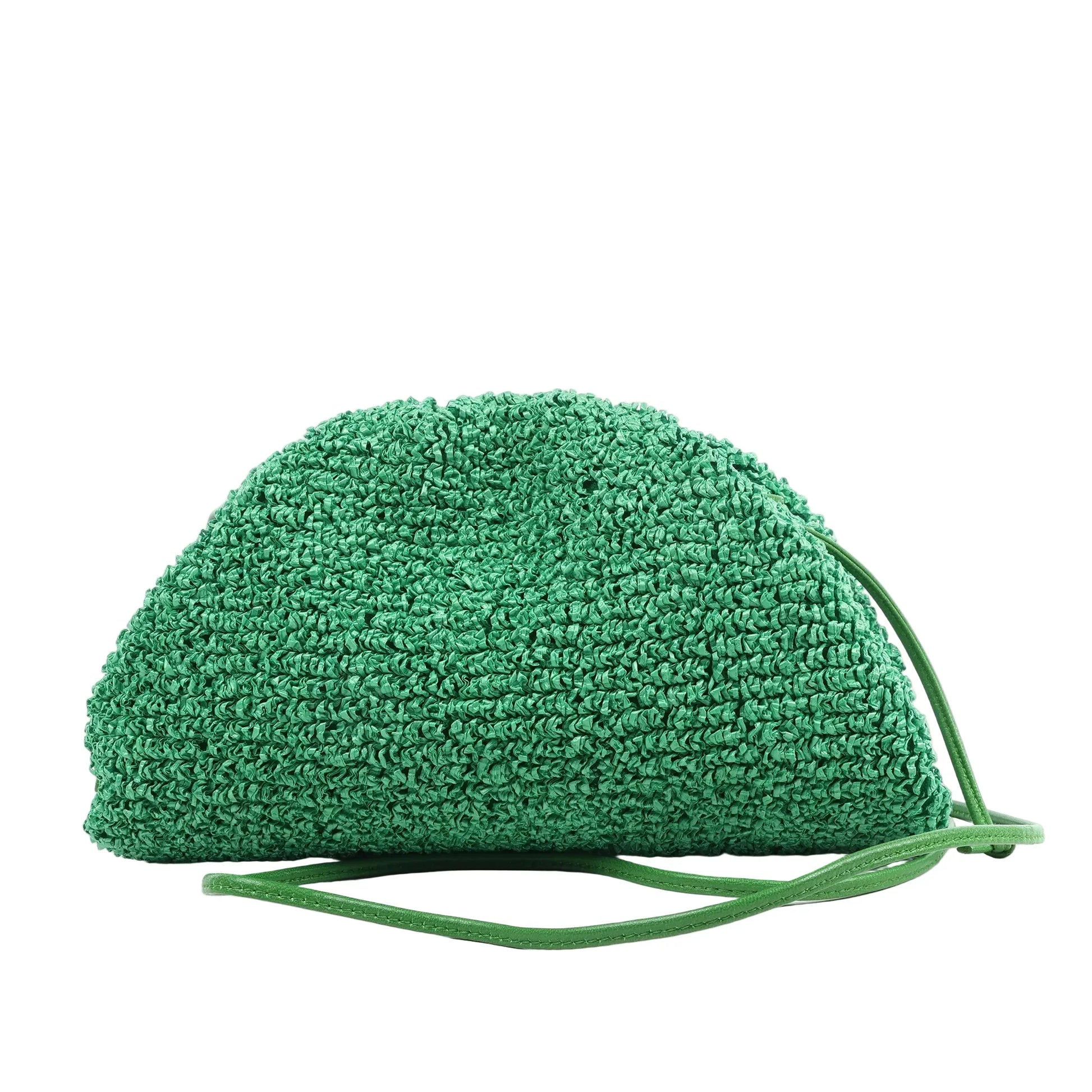 Bottega Veneta The Pouch Mini Crossbody bag in green raffia with a gathered top and slim green leather strap, shown against a white background.