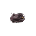 Purple Bottega Veneta mini leather crossbody bag with gathered drawstring top, slim leather strap, and gold-tone bead hardware.
