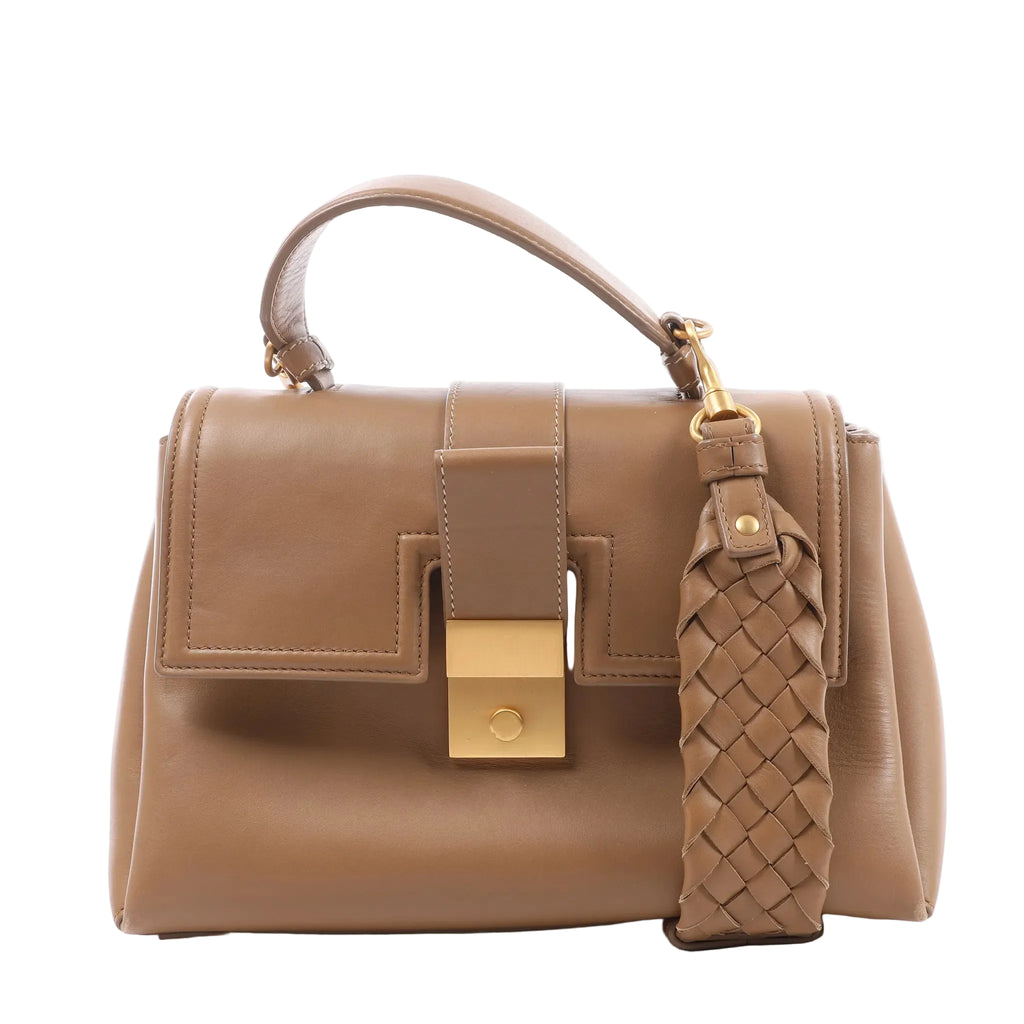 Bottega Veneta Piazza Small handbag in brown leather with a top handle, structured flap, gold-tone clasp and woven leather strap.