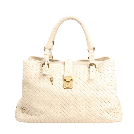 Bottega Veneta Intrecciato Roma handbag in beige leather featuring a woven design, structured silhouette, gold-tone lock closure, and dual rolled handles.