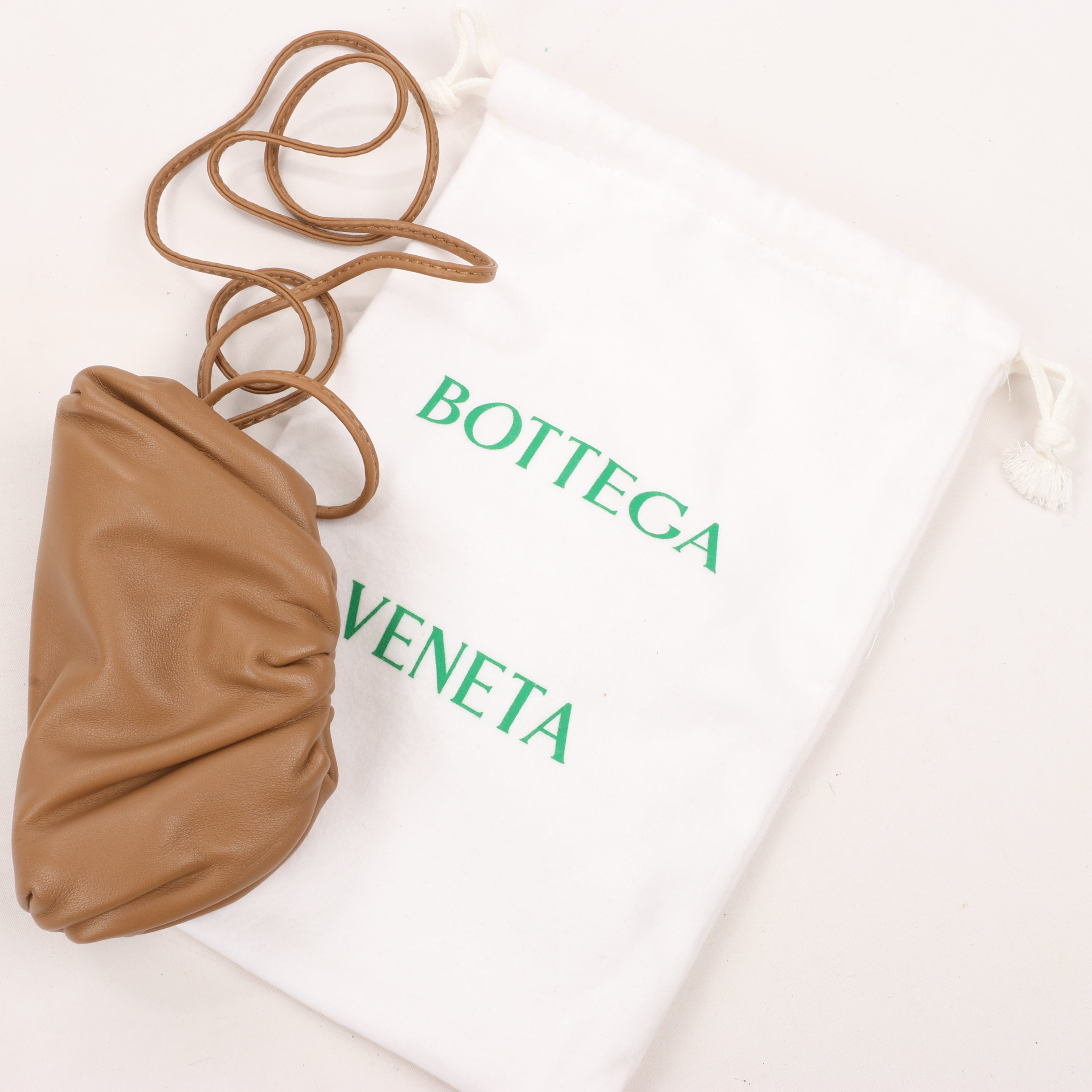 Bottega Veneta Micro The Pouch Leather Crossbody bag in Almond