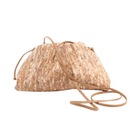Textured beige handbag with a drawstring on a white background