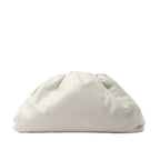 Bottega Veneta The Pouch Oversize clutch in soft beige leather with a voluminous gathered silhouette and concealed top closure.