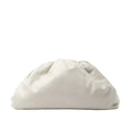 Bottega Veneta The Pouch Oversize clutch in soft beige leather with a voluminous gathered silhouette and concealed top closure.