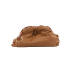 Oversized brown leather clutch bag with a soft slouchy shape, gathered top edge and smooth minimalist finish.