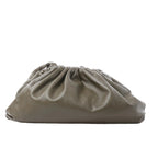 Bottega Veneta The Pouch Oversize green leather clutch with gathered ruched top and soft slouchy silhouette on white background