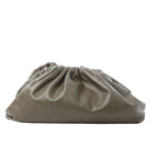 Bottega Veneta The Pouch Oversize green leather clutch with gathered ruched top and soft slouchy silhouette on white background