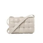 Bottega Veneta Padded Cassette crossbody bag with oversized padded Intrecciato leather weaving and a wide matching shoulder strap.
