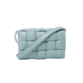 Light blue Bottega Veneta Padded Cassette crossbody bag with oversized padded Intrecciato leather weaving and a wide matching shoulder strap.