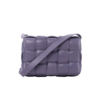 Purple Bottega Veneta Padded Cassette crossbody bag with oversized padded Intrecciato leather weaving and a wide matching shoulder strap.