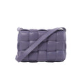 Purple Bottega Veneta Padded Cassette crossbody bag with oversized padded Intrecciato leather weaving and a wide matching shoulder strap.