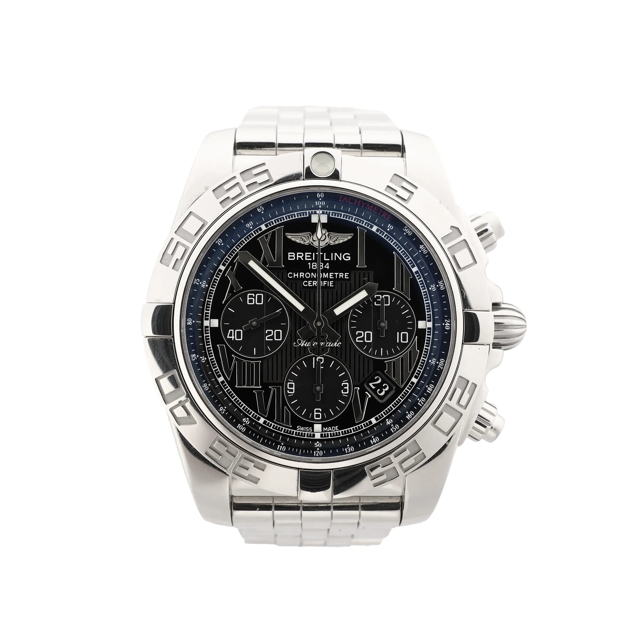 Close-up of Breitling Chronomat stainless steel watch with black Roman-numeral dial, three chronograph subdials, tachymeter ring, engraved bezel and date window.