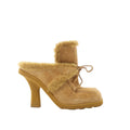 Burberry Highland beige suede mule with plush sheepskin trim, lace-up front, open back, platform sole and sculptural high heel.