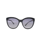 Bvlgari BV8158 black cat-eye sunglasses with gray tinted lenses, glossy frame, slim curved temples and subtle gold-tone branding on white background.