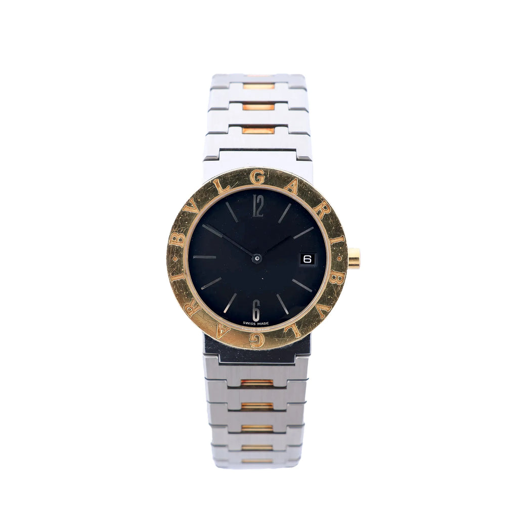 Bvlgari Bvlgari BB33SGD watch with black dial, gold-tone logo bezel, stainless steel and yellow gold bracelet, date window, and round case on white background.