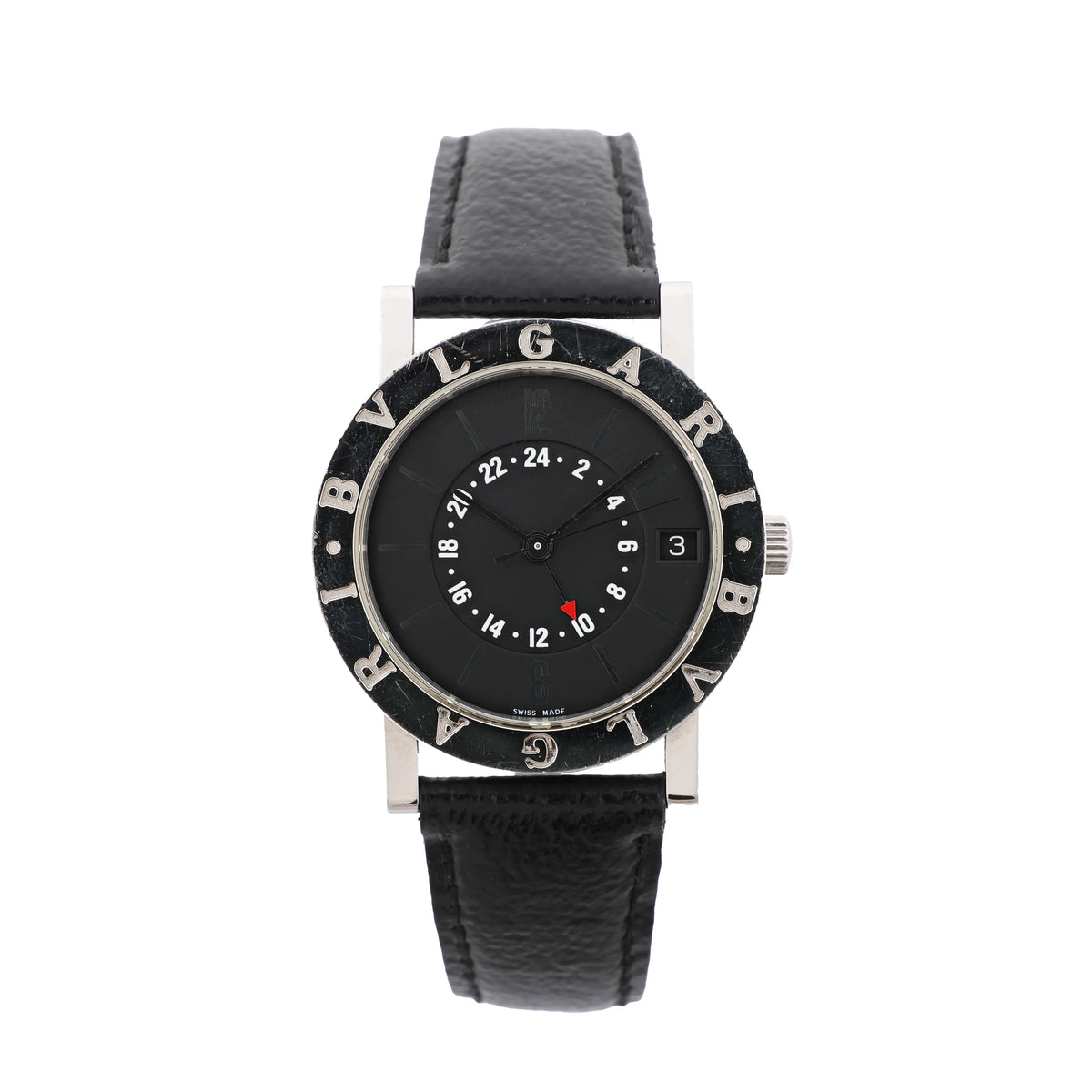 Front view of a Bvlgari Bvlgari watch with a black dial, white 24-hour scale, red-tipped GMT hand, engraved bezel and black leather strap.
