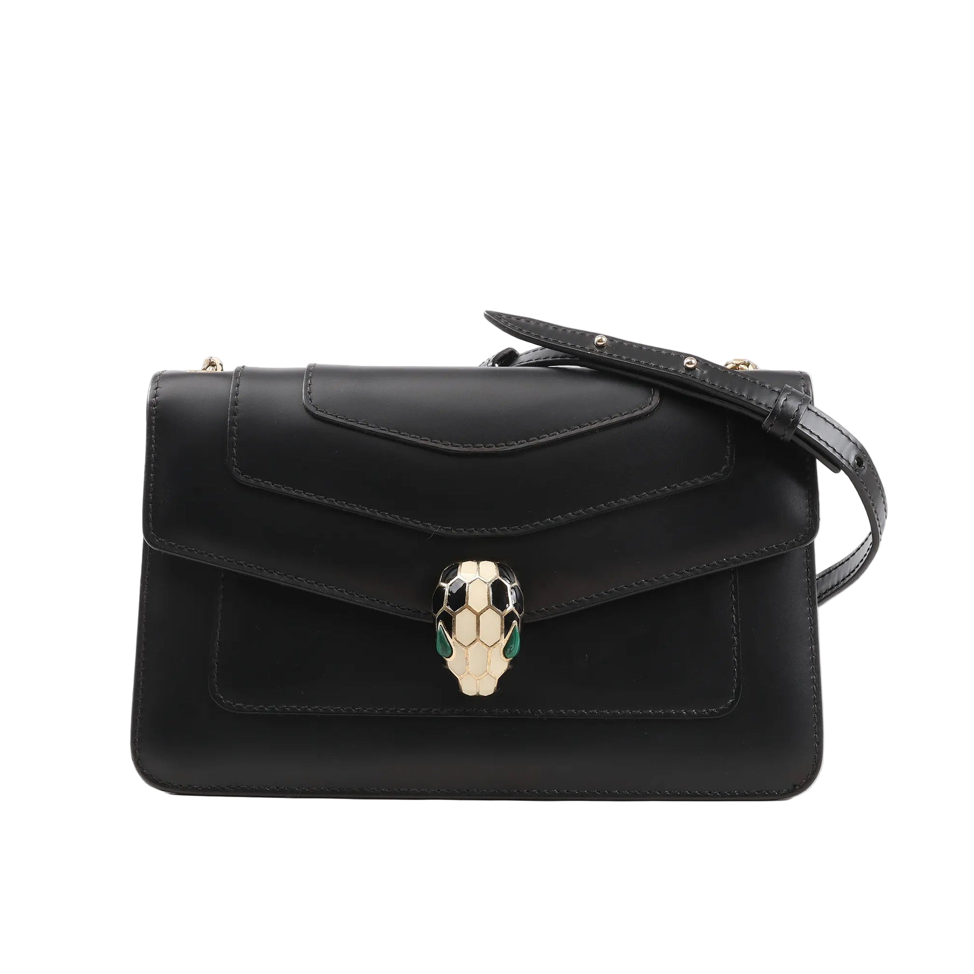 BVLGARI Serpenti Forever chain shoulder bag in black calf leather, featuring a structured silhouette with flap closure, signature enamel Serpenti head clasp in black, white, and green, and a partially visible gold-tone chain strap, set against a white background.