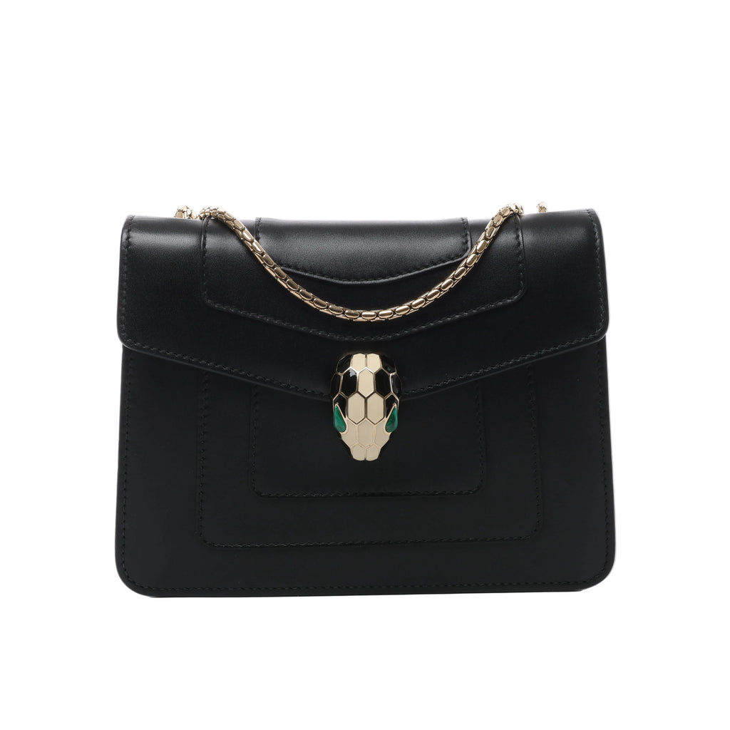 Black Bvlgari Serpenti Forever leather shoulder bag with gold-tone chain strap and signature snake-head clasp with green accents.