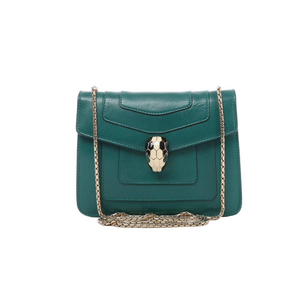 Green Bvlgari Serpenti Forever leather shoulder bag with layered flap front, gold-tone chain strap and signature serpent-head clasp.