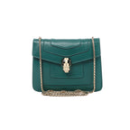 Green Bvlgari Serpenti Forever leather shoulder bag with layered flap front, gold-tone chain strap and signature serpent-head clasp.