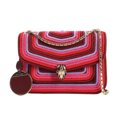 BVLGARI Serpenti Forever shoulder bag made of pink, red, and purple polyester cord with leather trim, featuring a gold-tone snakehead clasp and chain strap.