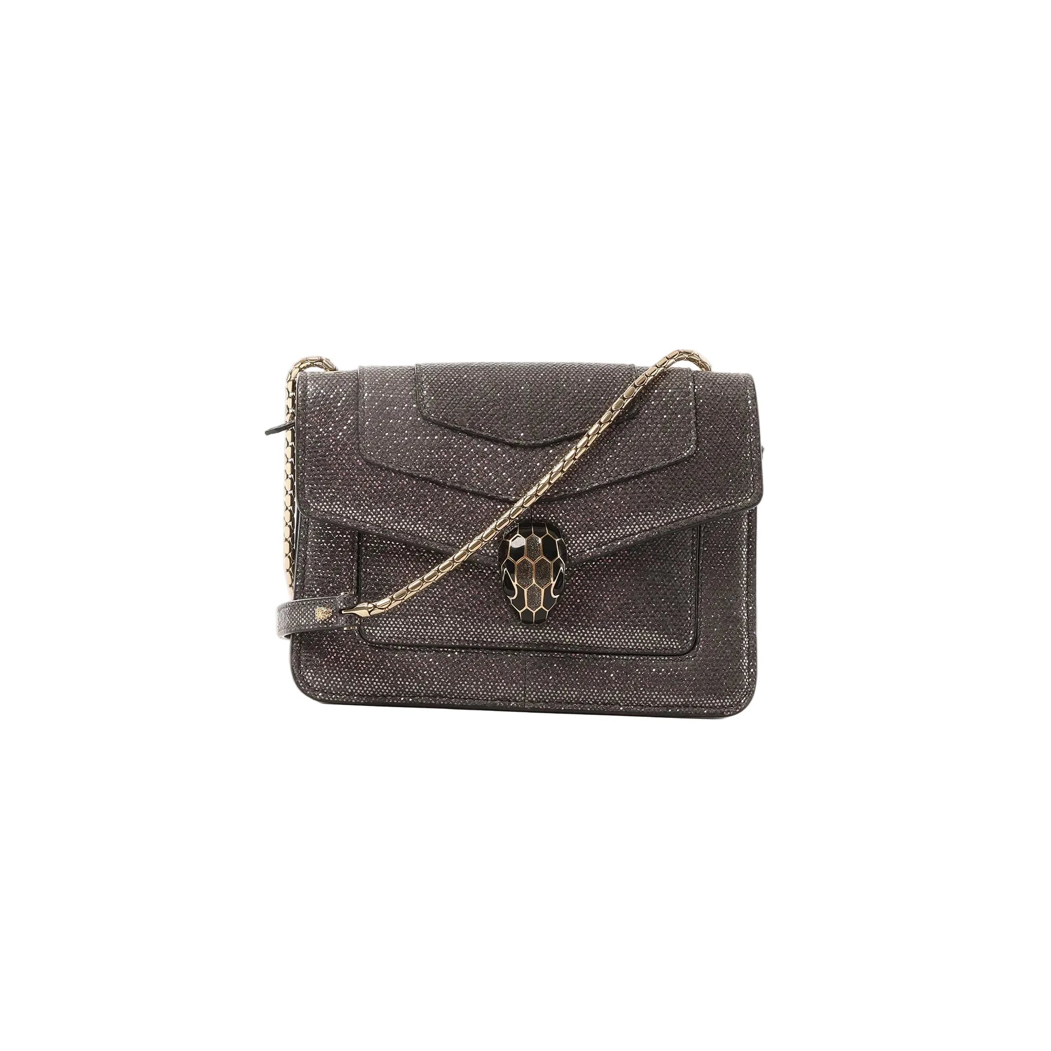 BVLGARI Serpenti gray glitter leather crossbody bag with gold-tone chain strap and black-and-gold serpent head clasp, front view on a white background.