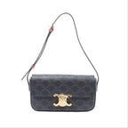 Brown Celine Triomphe Claude monogram shoulder bag with gold-tone Triomphe clasp and slim adjustable leather strap.