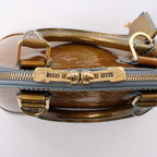 Bolso de mano Louis Vuitton Alma BB Monogram Vernis 2Way en dorado M91677