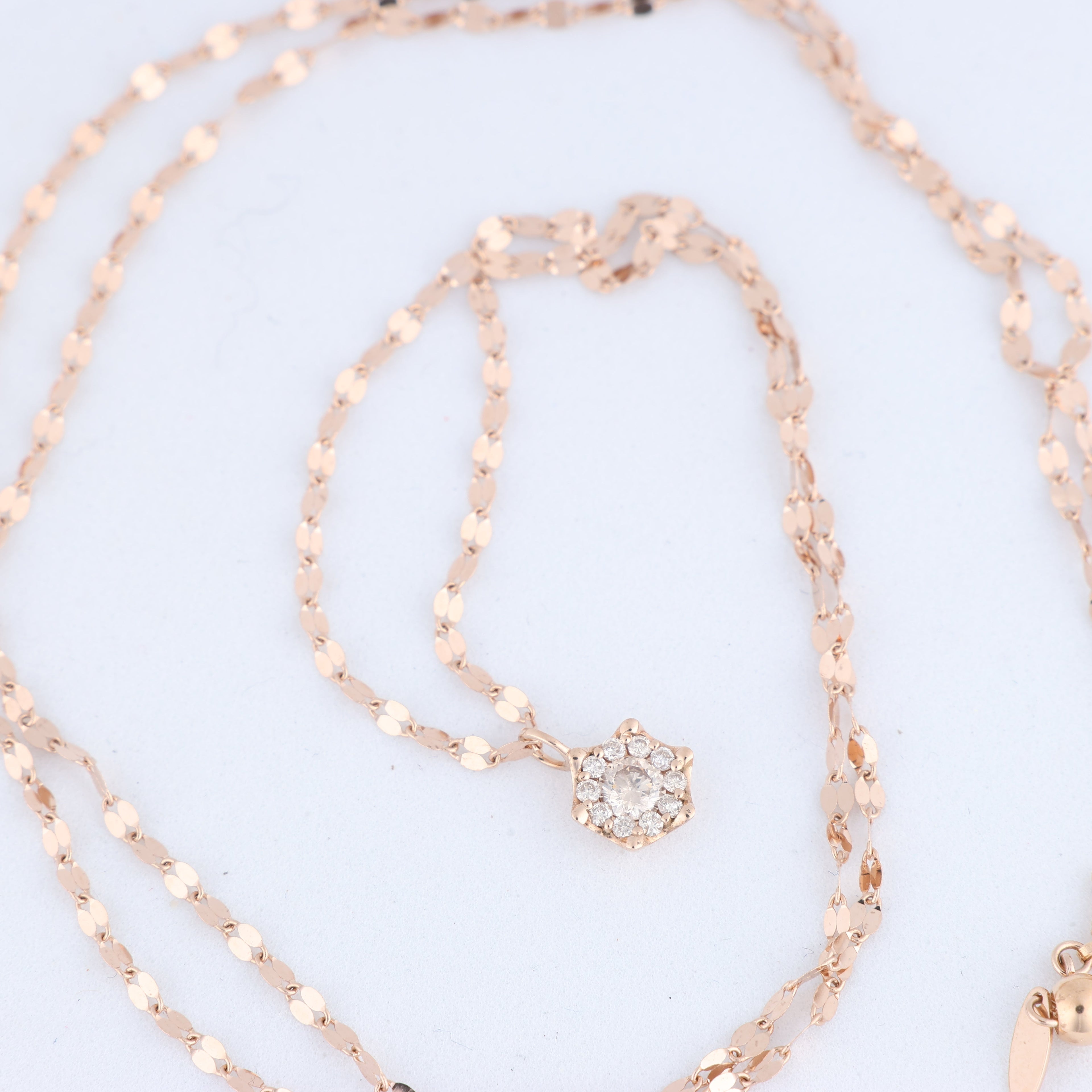 Non Signe / Unsigned Rose Gold (18k) chain and pendant set with 11 natural diamonds