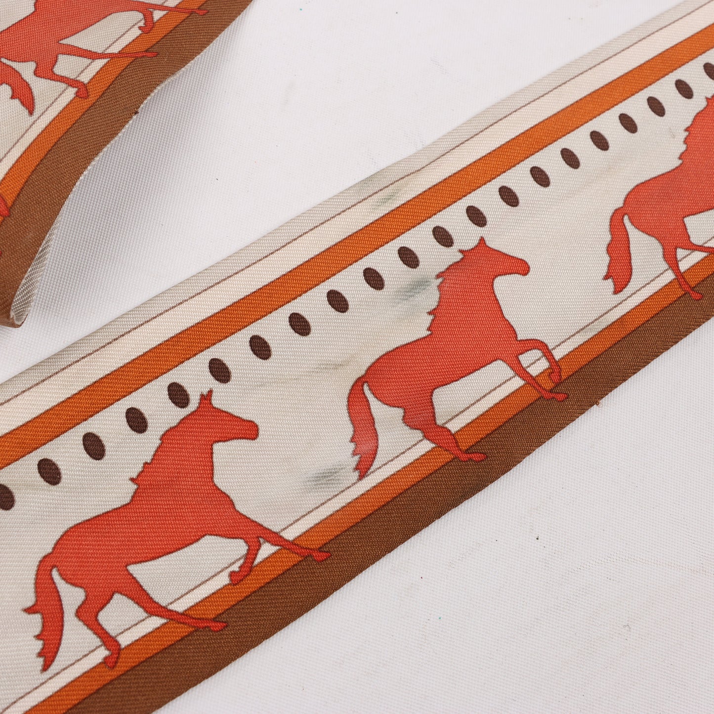 Hermès Sequences Horse Twilly Scarves in Orange