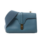 Blue CELINE Soft 16 Teen leather shoulder bag with wide tonal textile strap, structured flap and gold-tone clasp hardware.