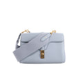 Light blue CELINE Soft 16 Teen leather shoulder bag with wide tonal textile strap, structured flap and gold-tone clasp hardware.