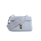 Light blue CELINE Soft 16 Teen leather shoulder bag with wide tonal textile strap, structured flap and gold-tone clasp hardware.