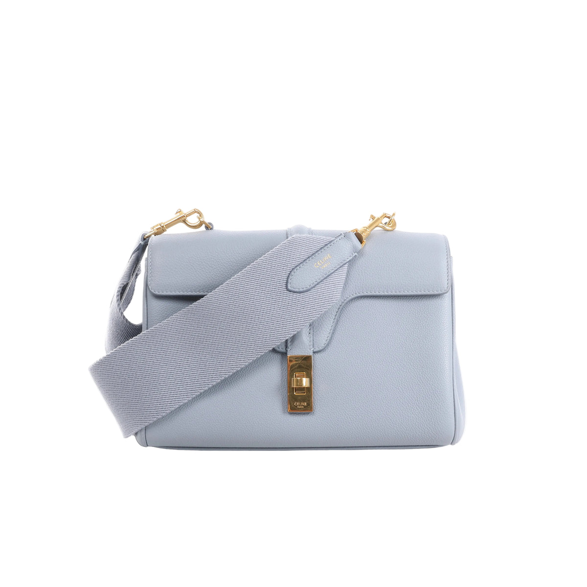 Light blue CELINE Soft 16 Teen leather shoulder bag with wide tonal textile strap, structured flap and gold-tone clasp hardware.