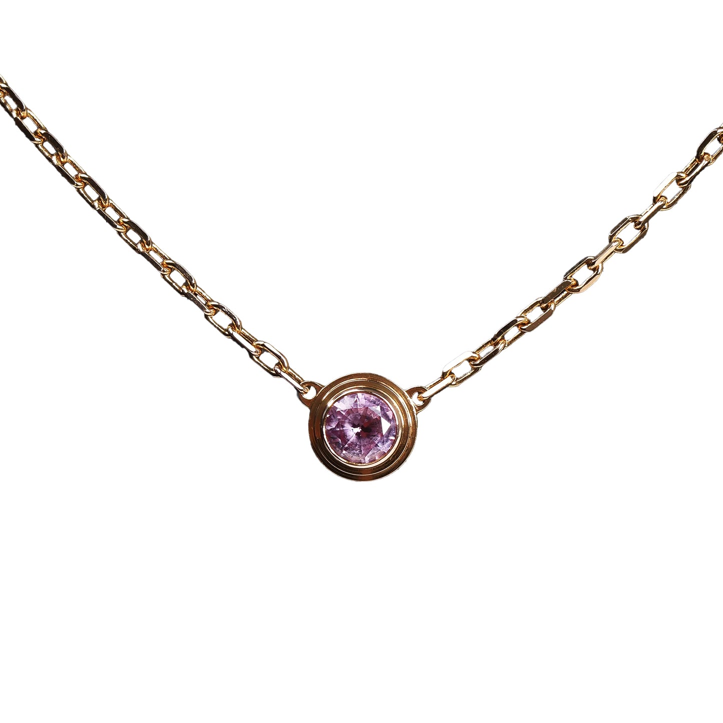 Cartier D’Amour necklace model PZ7522 crafted in 750 yellow gold with a round-cut pink sapphire in a bezel setting, displayed on a fine gold chain.