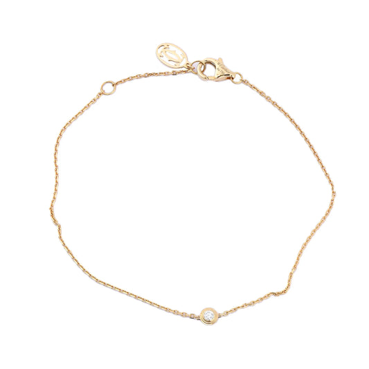 Cartier D'Amour XS bracelet in 18K yellow gold featuring a single bezel-set round diamond on a fine chain with lobster clasp and Cartier charm, model QQC093 CRB6045617, weight 1.4g.