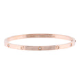Cartier Love SM rose gold bangle bracelet with screw motifs and small diamond accents on a white background